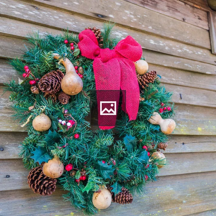 Holiday wreath on wooden house