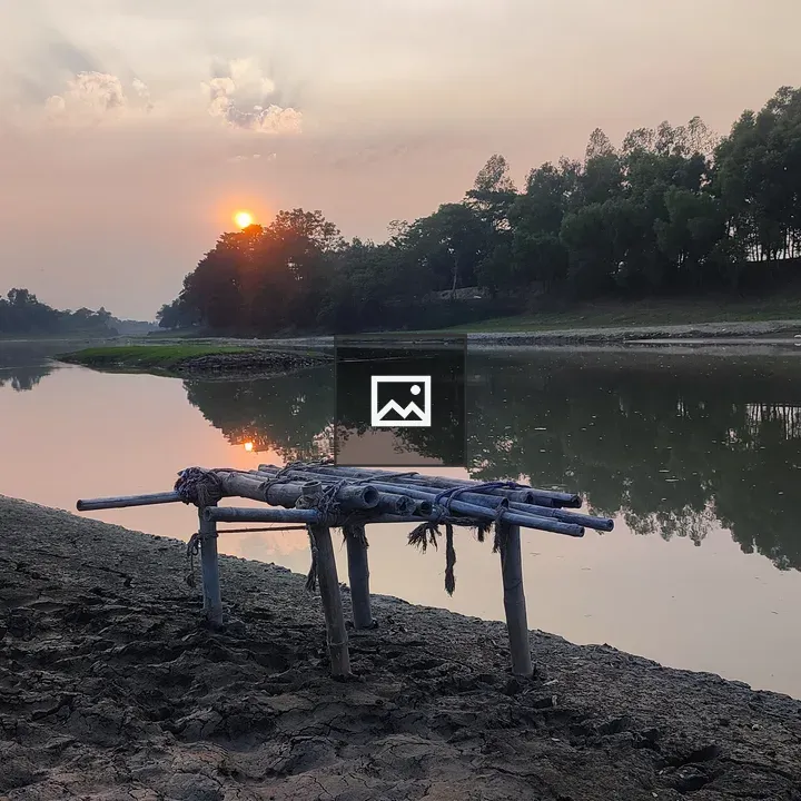 Calm River at Sunset with Bamboo Platform