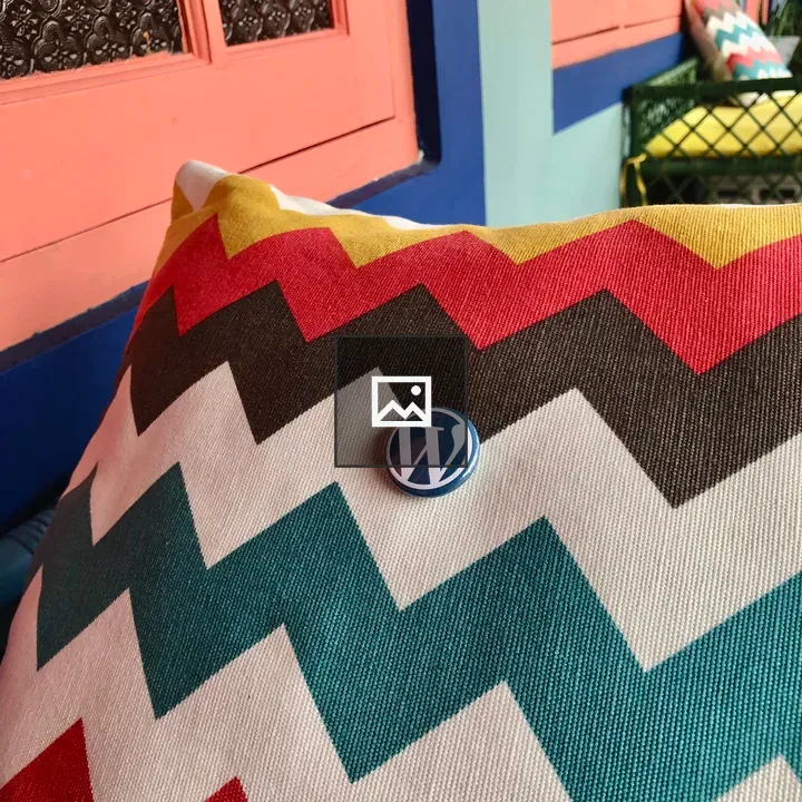 WordPress button on a colorful pillow