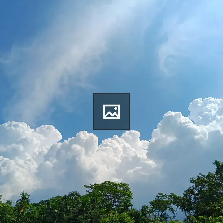 Bright blue sky with fluffy clouds