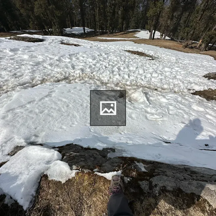 Person on snowy slope edge