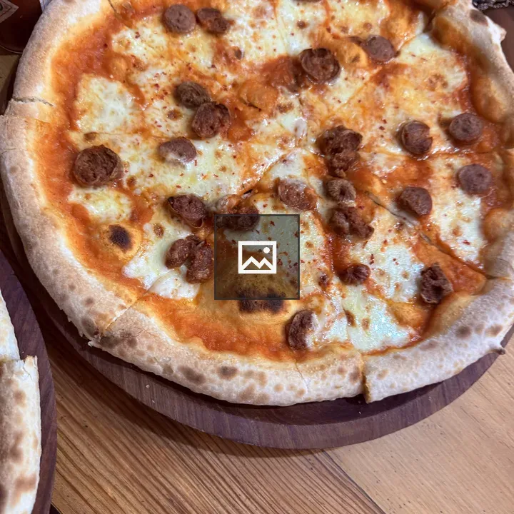 Pizza on Wooden Plate
