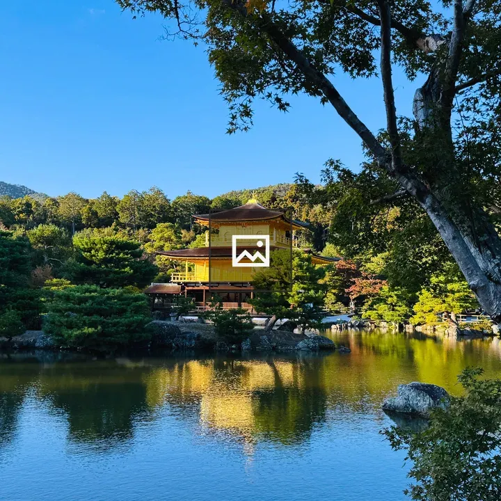Golden pavilion by tranquil pond