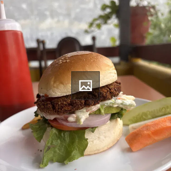 Burger on Plate with Lettuce and Tomato