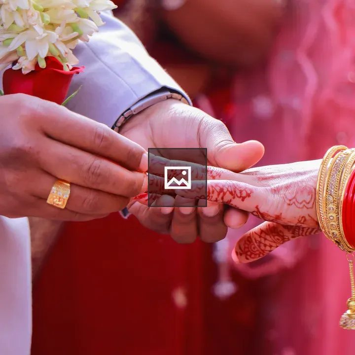 Engaged couple exchanging rings