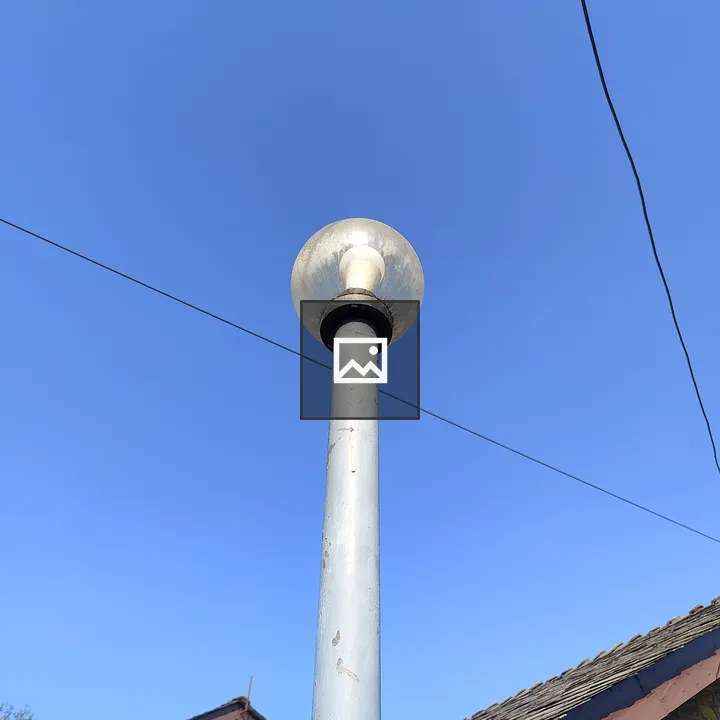 Tall lamppost with glass globe
