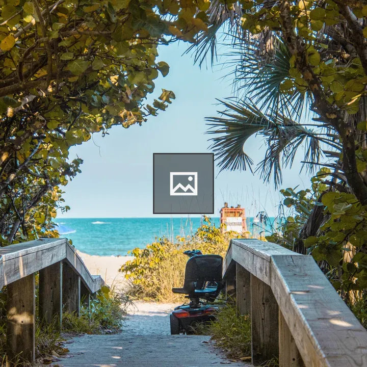 Scooter on boardwalk to beach
