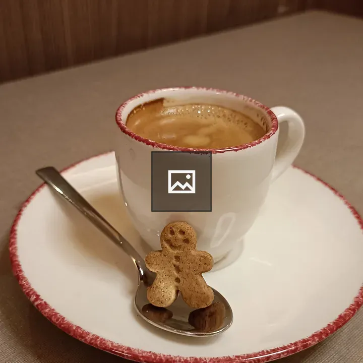 Happy gingerbread man with coffee cup