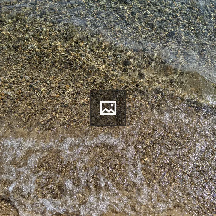 Rocks under waves on Lake Michigan shore