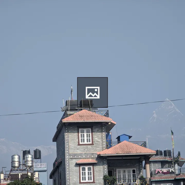 Building with Red Roofs and Solar Panels