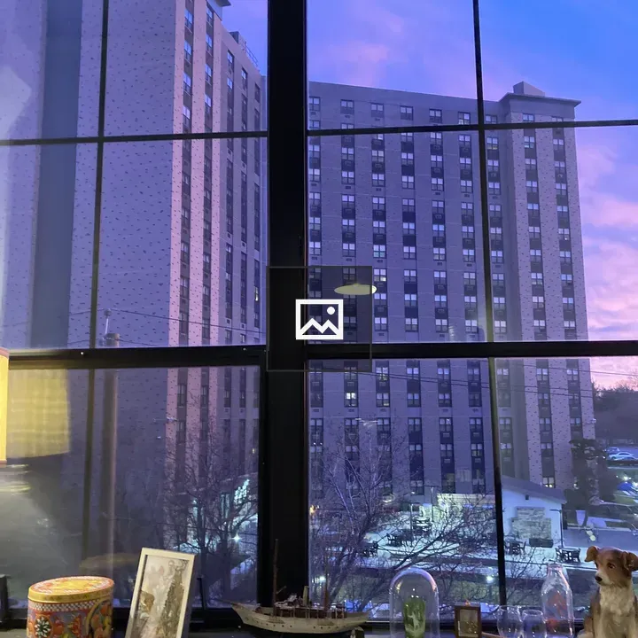 City skyline through window at twilight