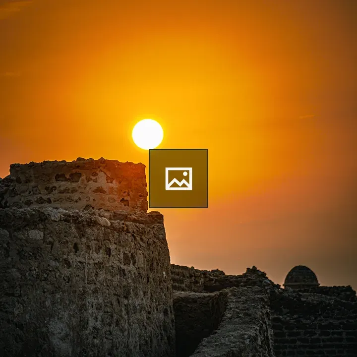 Sunset at Bahrain Fort silhouetted
