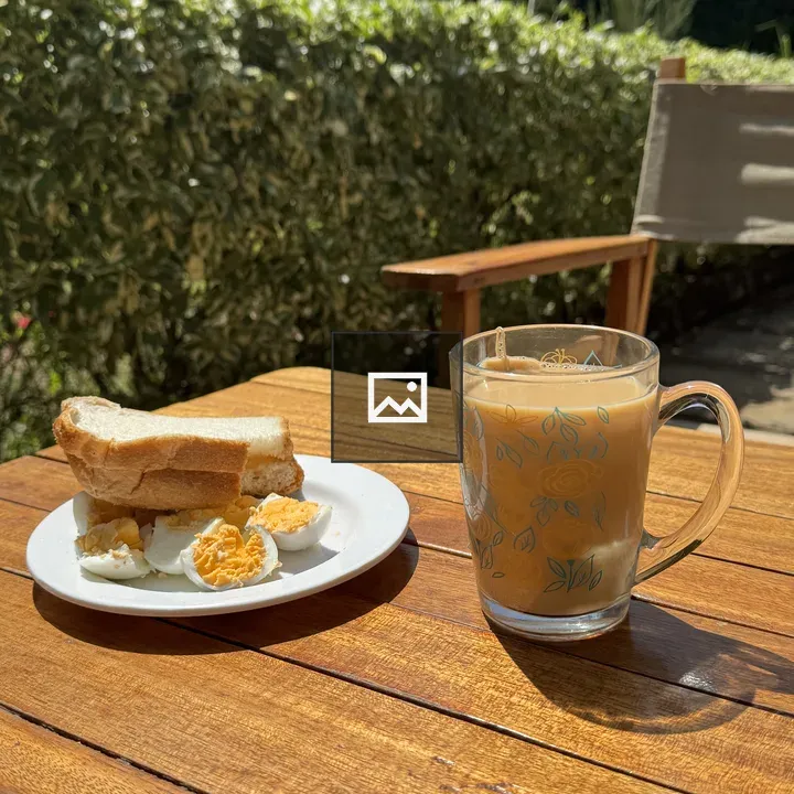 Eggs and tea on wooden table