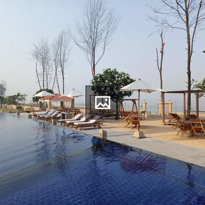 Infinity pool with lounge chairs