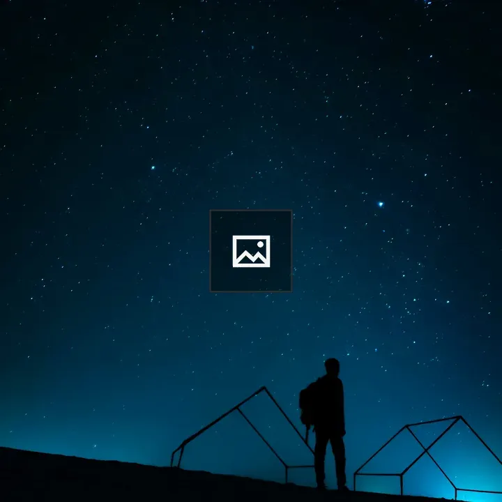 Silhouette on Hill Under Stars