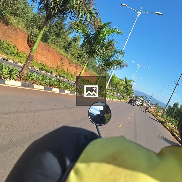 Motorcycle handlebars on road in Kigali