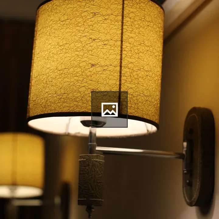 Stylish wall lamp with textured yellow shade