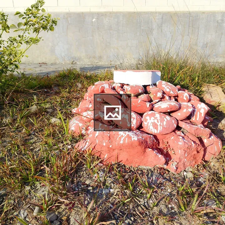 Red Rock Pile in Grass