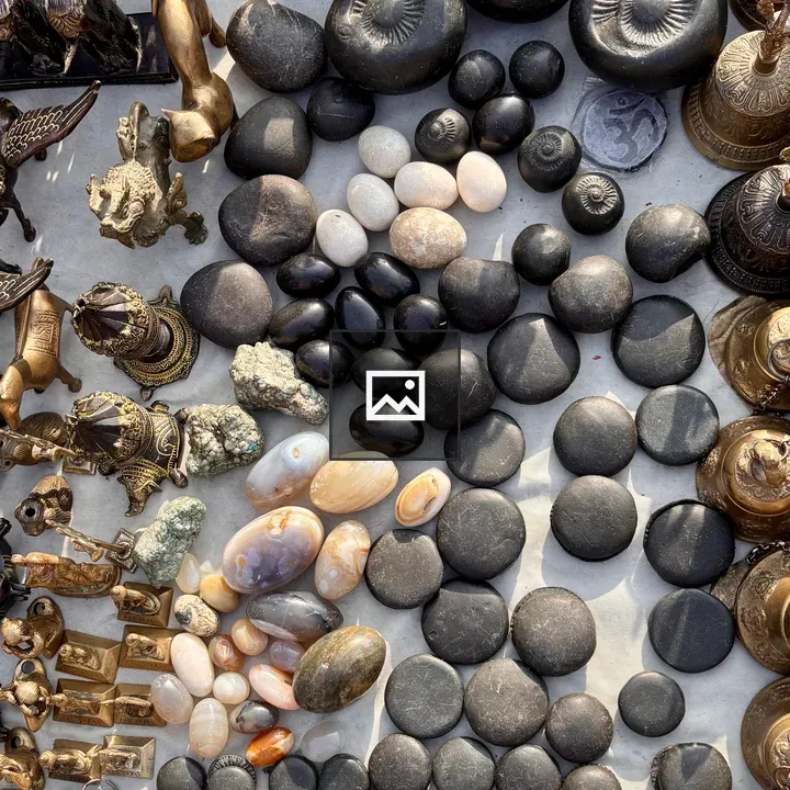 Shaligram stones and brass figurines