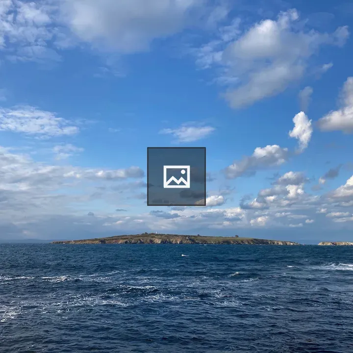 Ocean view with island and clouds