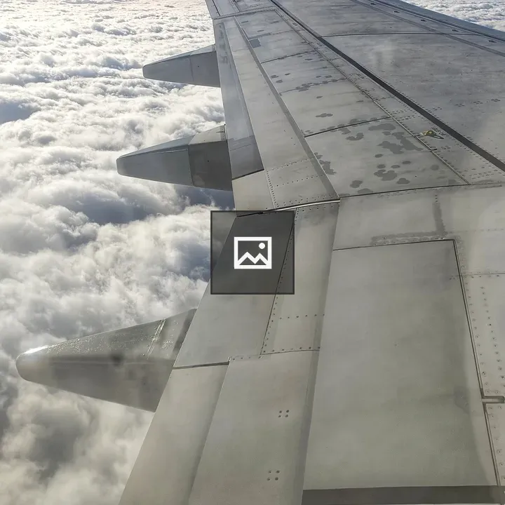 Plane wing over the clouds