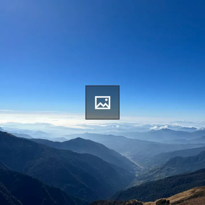 Panoramic Mountains Under Blue Sky