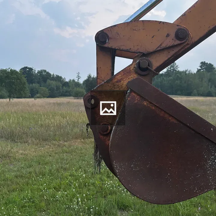 Backhoe Bucket in Field