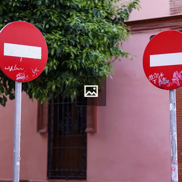 No entry signs with graffiti