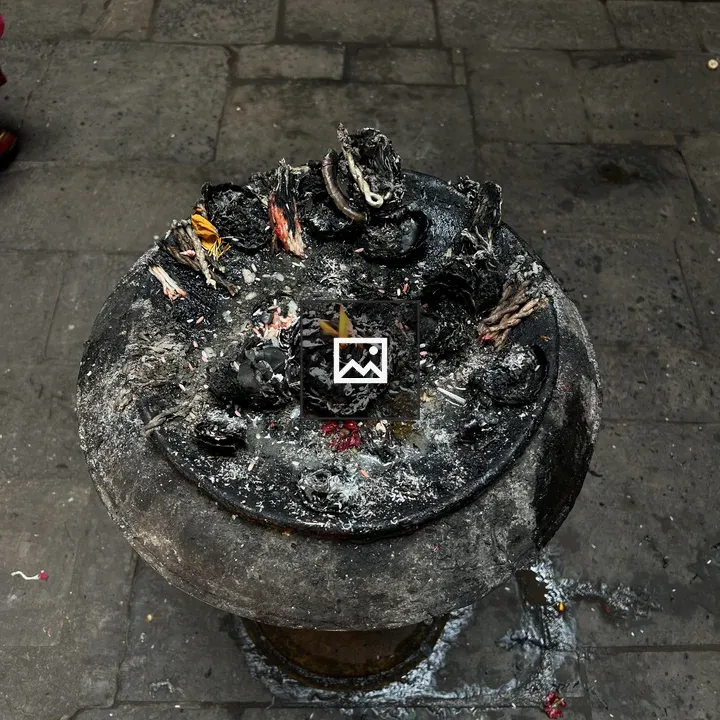 Stone ritual dish with burning lamps
