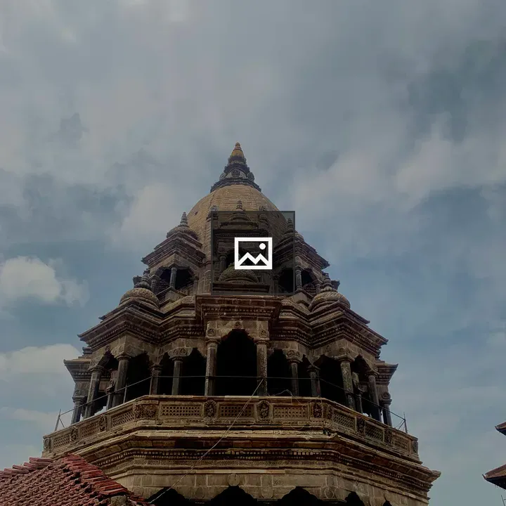 Temple Tower Against Cloudy Sky