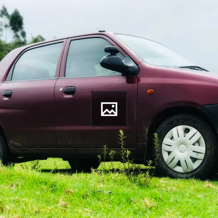 Maroon Car on Grass Field