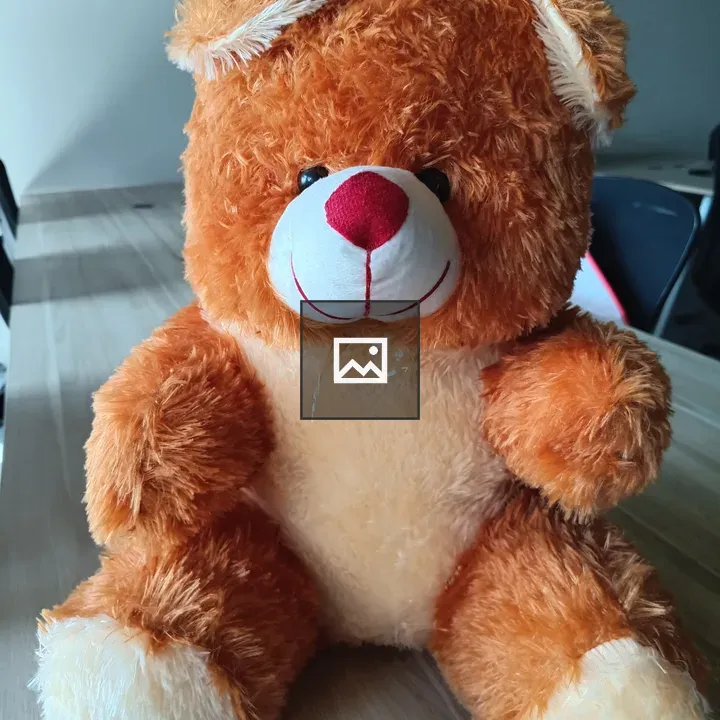 Teddy bear on wooden surface