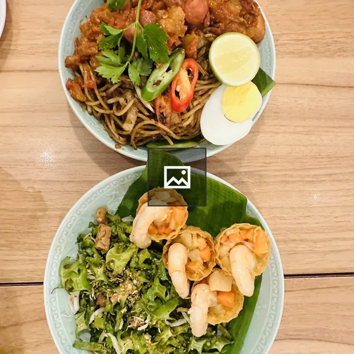 Two Plates of Noodles and Chicken