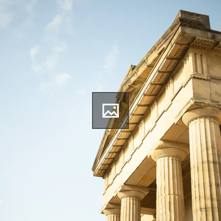Upper section of classical stone building