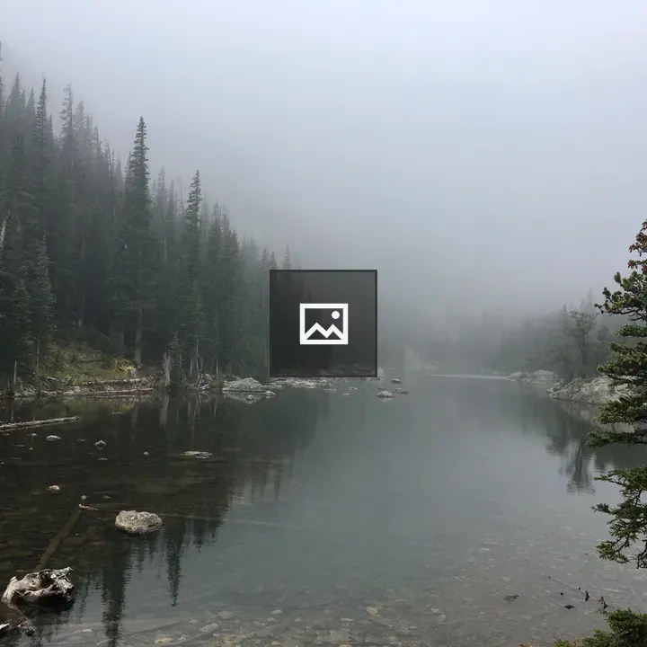 Pond in mountains with trees