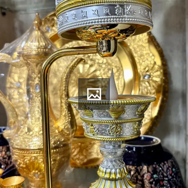 Metallic decorative cup with wax teardrop