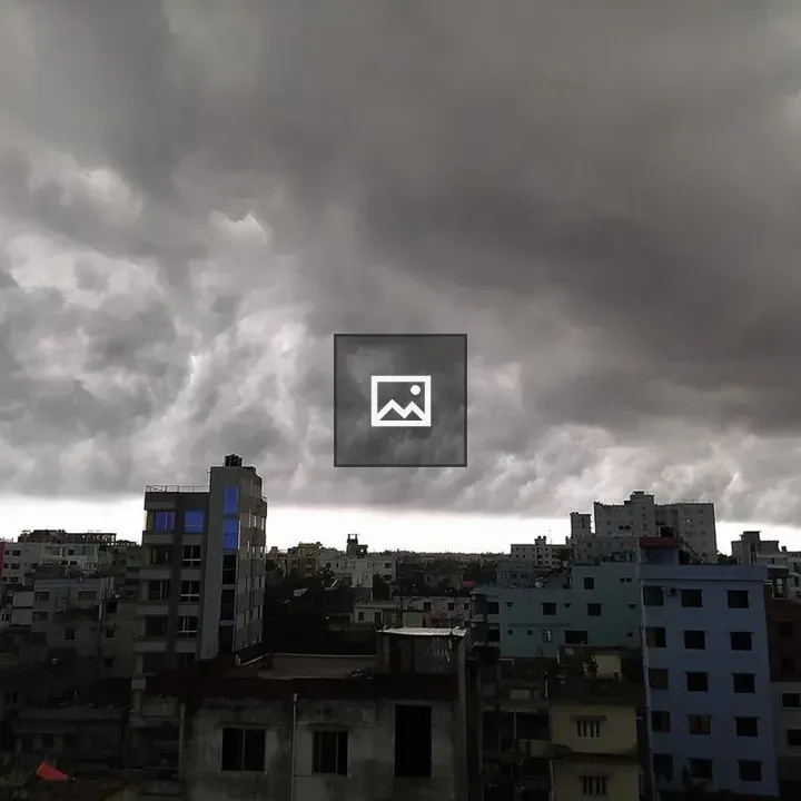 Cloudy skies above building