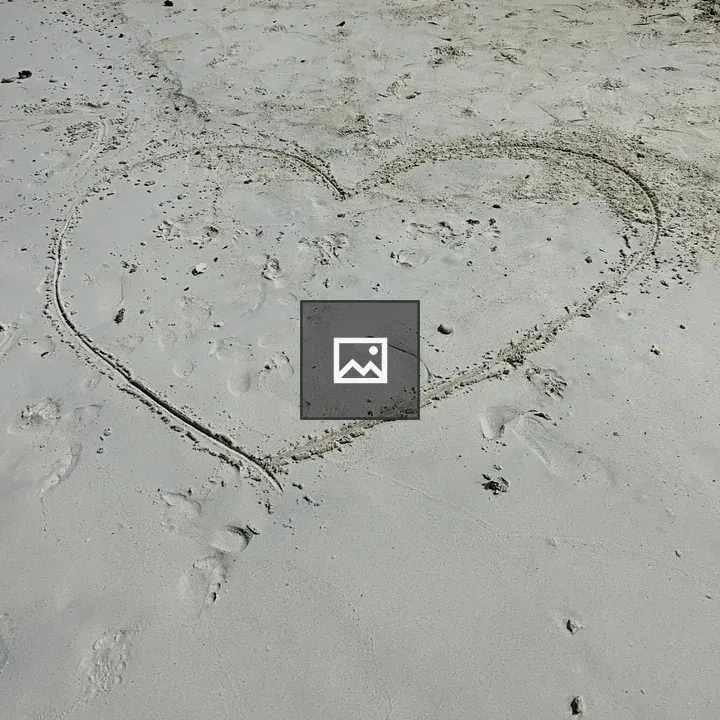 Heart drawn in beach sand