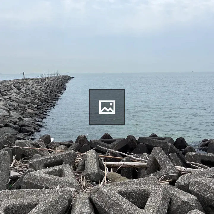 Rocky breakwater with concrete blocks