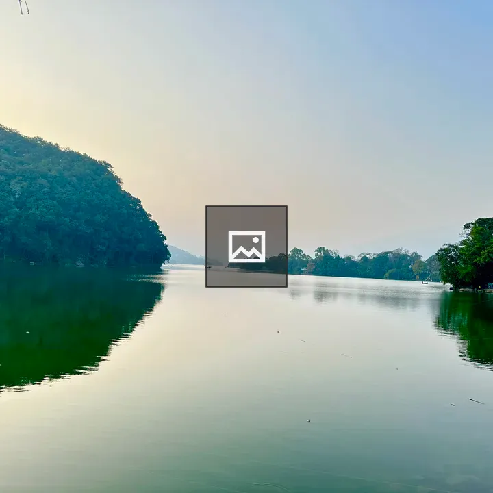 Serene lake among trees and hills