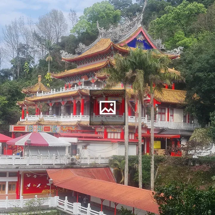 Colorful multi-tier temple on hillside