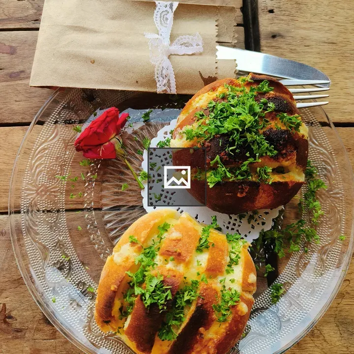 Bread rolls with parsley on table