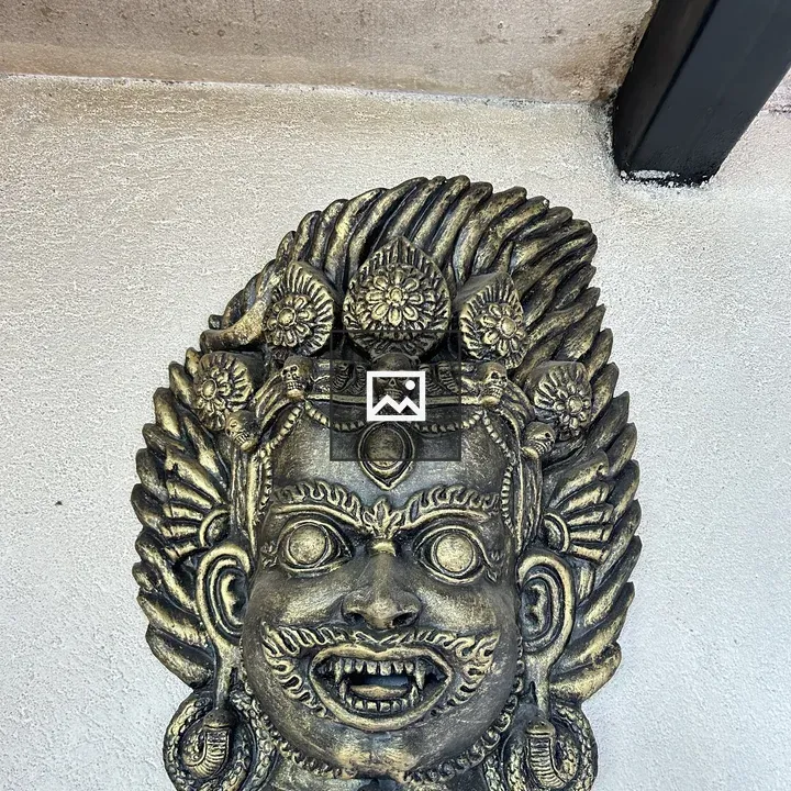 Ornate bronze mask