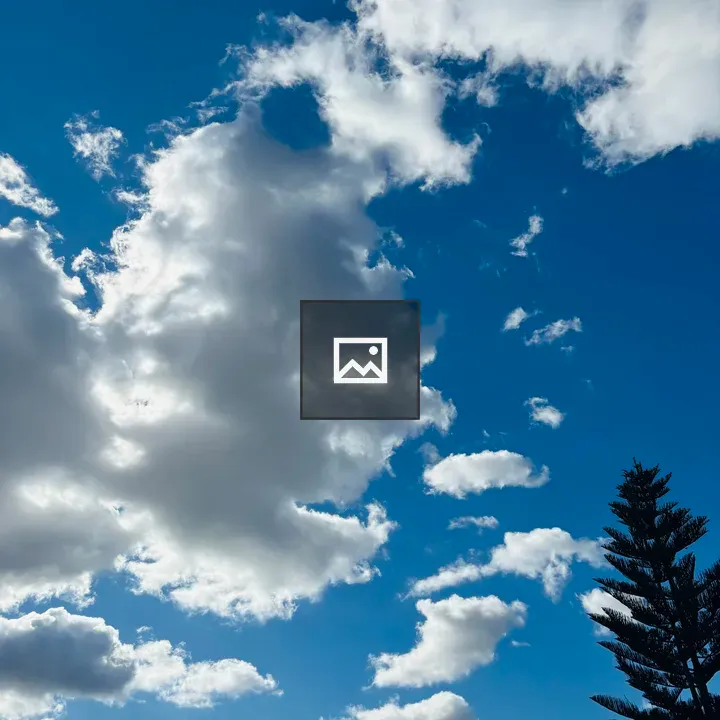 Blue Sky with Clouds Above Tree