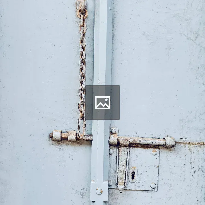 Rustic metal door with chain