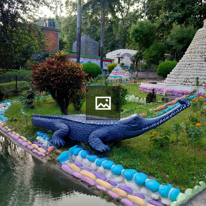 Crocodile sculpture by the pond