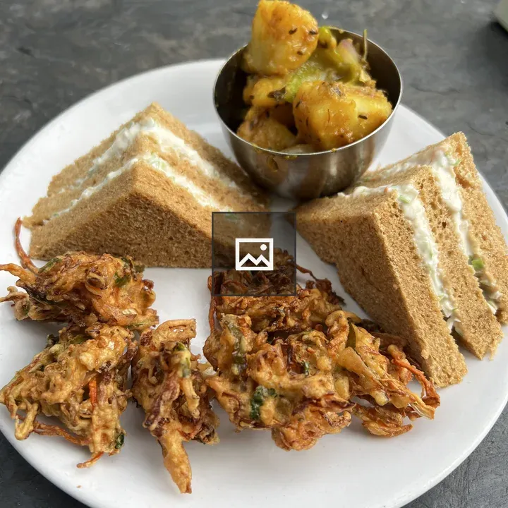 Breakfast plate with fritters and sandwiches