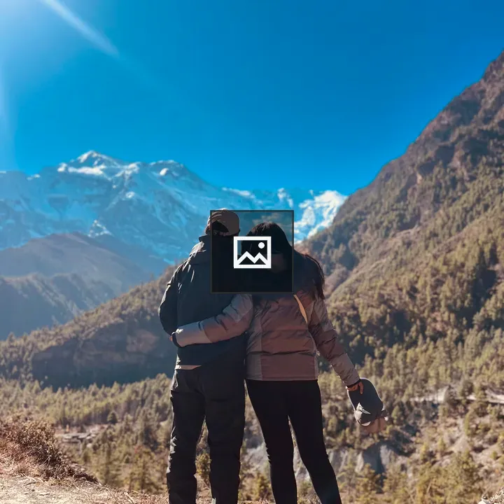 Couple in Snow-Capped Mountains