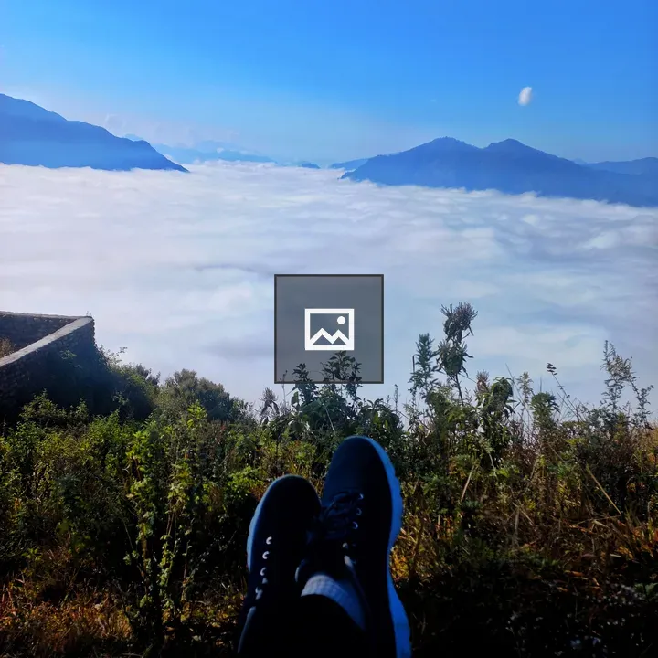 Feet on Grass with Mountains
