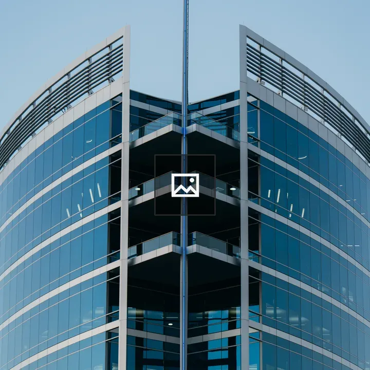 Modern office building with V-shaped glass facade